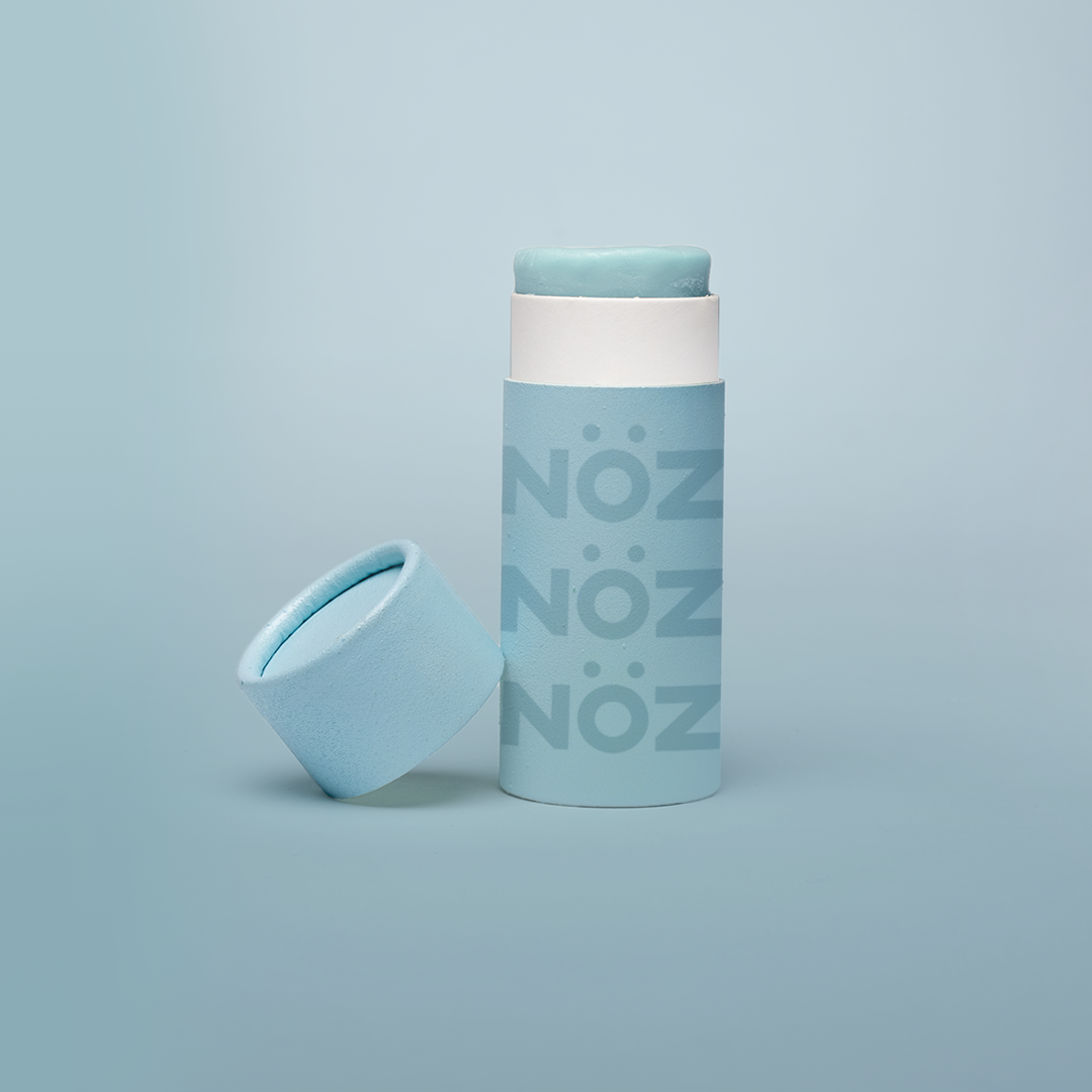 Front view of blue Noz sunscreen for body and for face