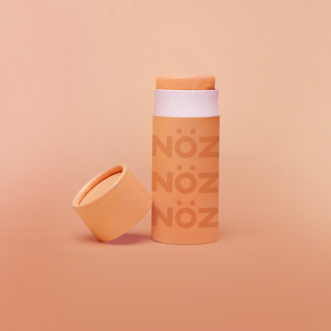 Front view of orange Noz sunscreen for body and for face