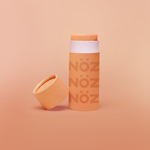 Load image into Gallery viewer, Front view of orange Noz sunscreen for body and for face
