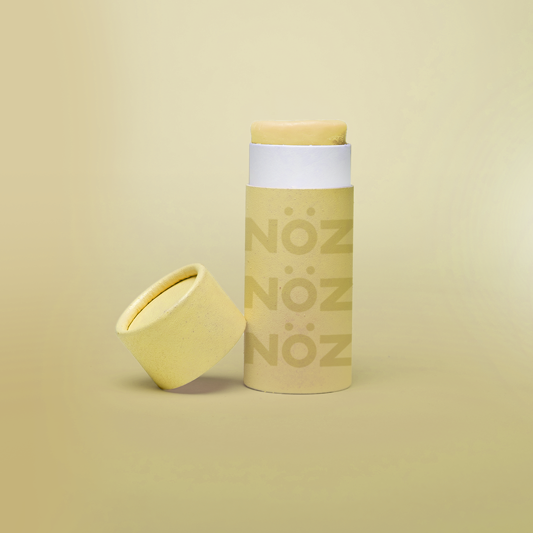 Front view of yellow Noz sunscreen for body and for face