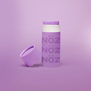 Front view of purple Noz sunscreen for body and for face